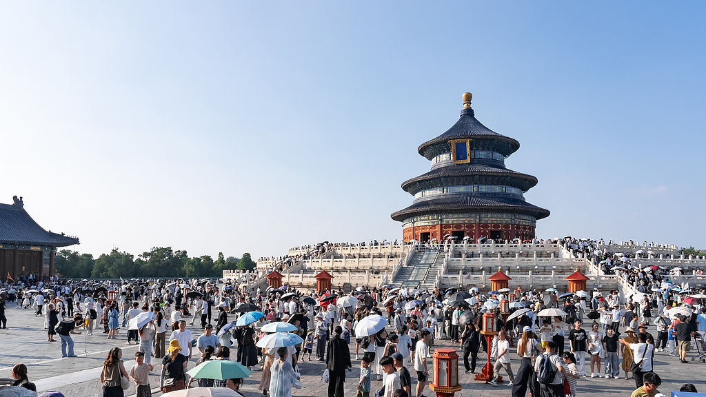 Visitors throng the Temple of Heaven in Beijing on August 24, 2026. /VCG