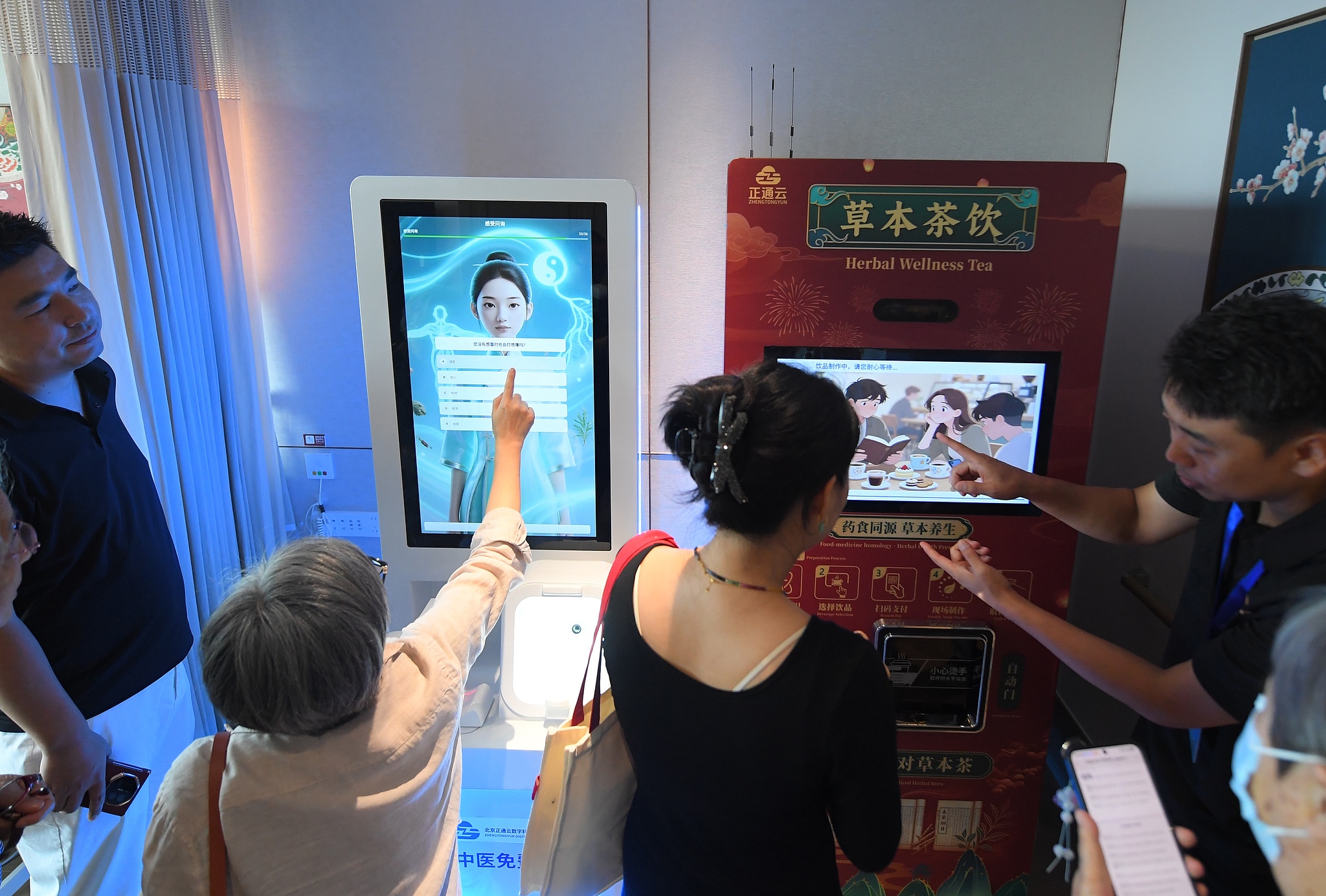 A staff member teaches older adults how to use smart elderly care robots in Beijing, China, August 3, 2026. /CFP