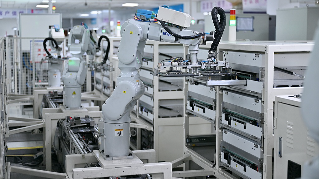 Robots conduct fully automated testing and sorting of motherboards at a company's smart manufacturing workshop in Hefei, Anhui Province, China, August 25, 2026./VCG