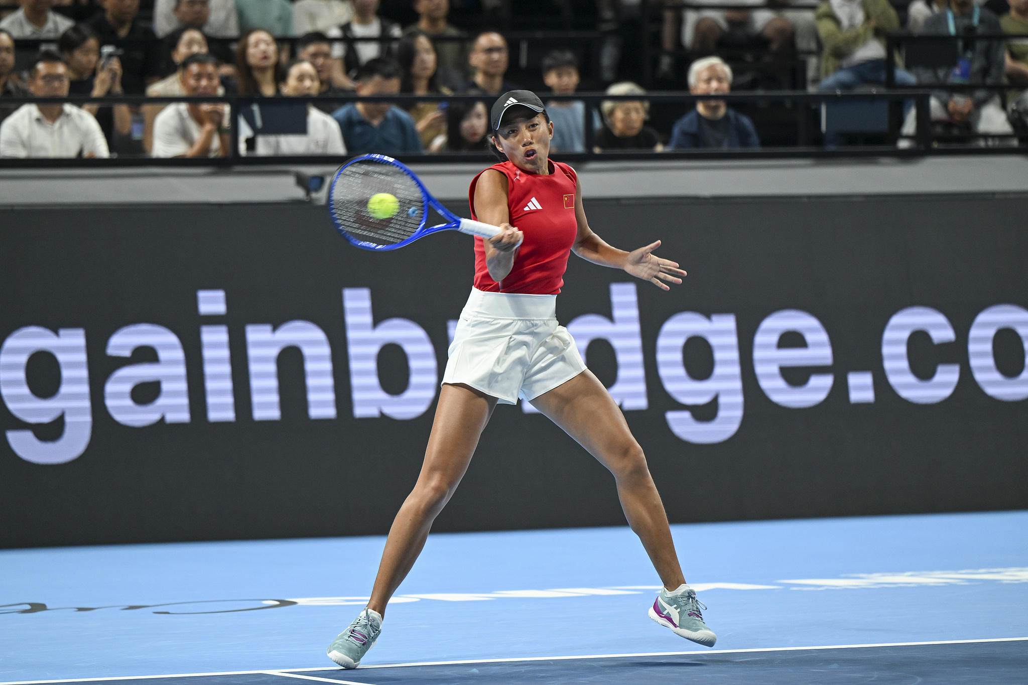 China's Zhang Shuai hits a shot against Italy's Elisabetta Cocciaretto in a singles match at the Billie Jean King Cup Finals in Shenzhen, south China's Guangdong Province, September 24, 2026. /VCG