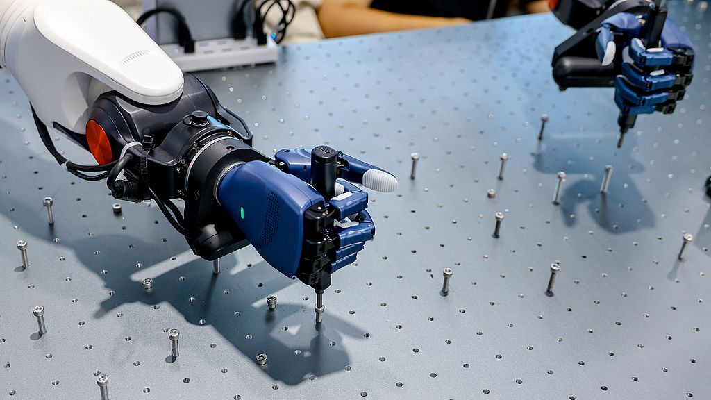 A robot tightens screws at the 2026 Inclusion Conference on the Bund, Shanghai, China, September 10, 2026. /VCG