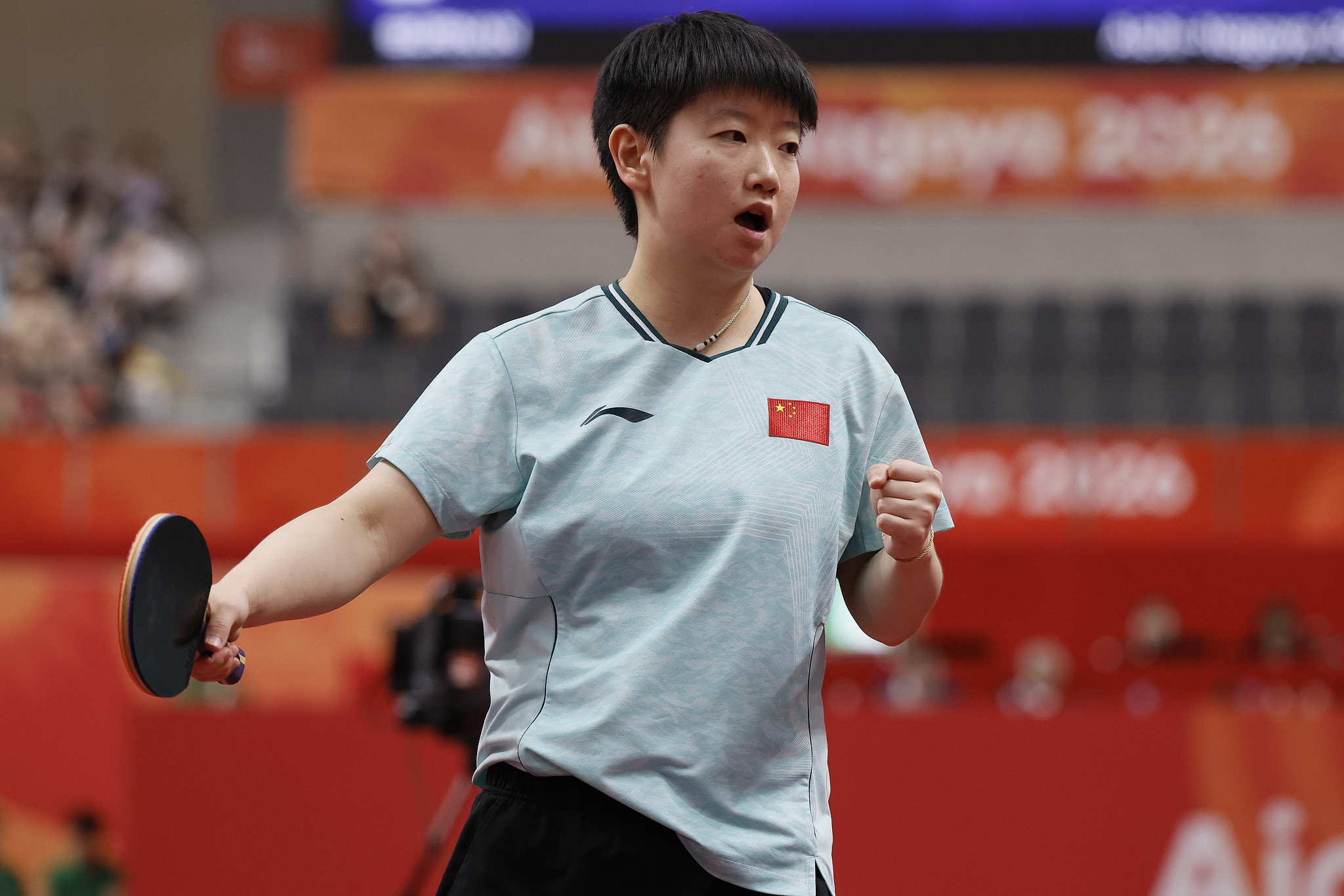 China's Sun Yingsha celebrates after scoring a point in a singles match against Japan's Hina Hayata in the women's table tennis team final at the 2026 Aichi-Nagoya Asian Games in Aichi, Japan, September 24, 2026. /VCG