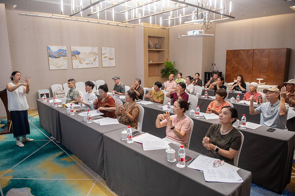 Professional teachers from Huzhou Education and Rehabilitation School give practical sign‑language training for people with late‑onset hearing loss at the training base of Changxing County Disabled Persons' Federation, Huzhou, east China's Zhejiang Province. /CFP