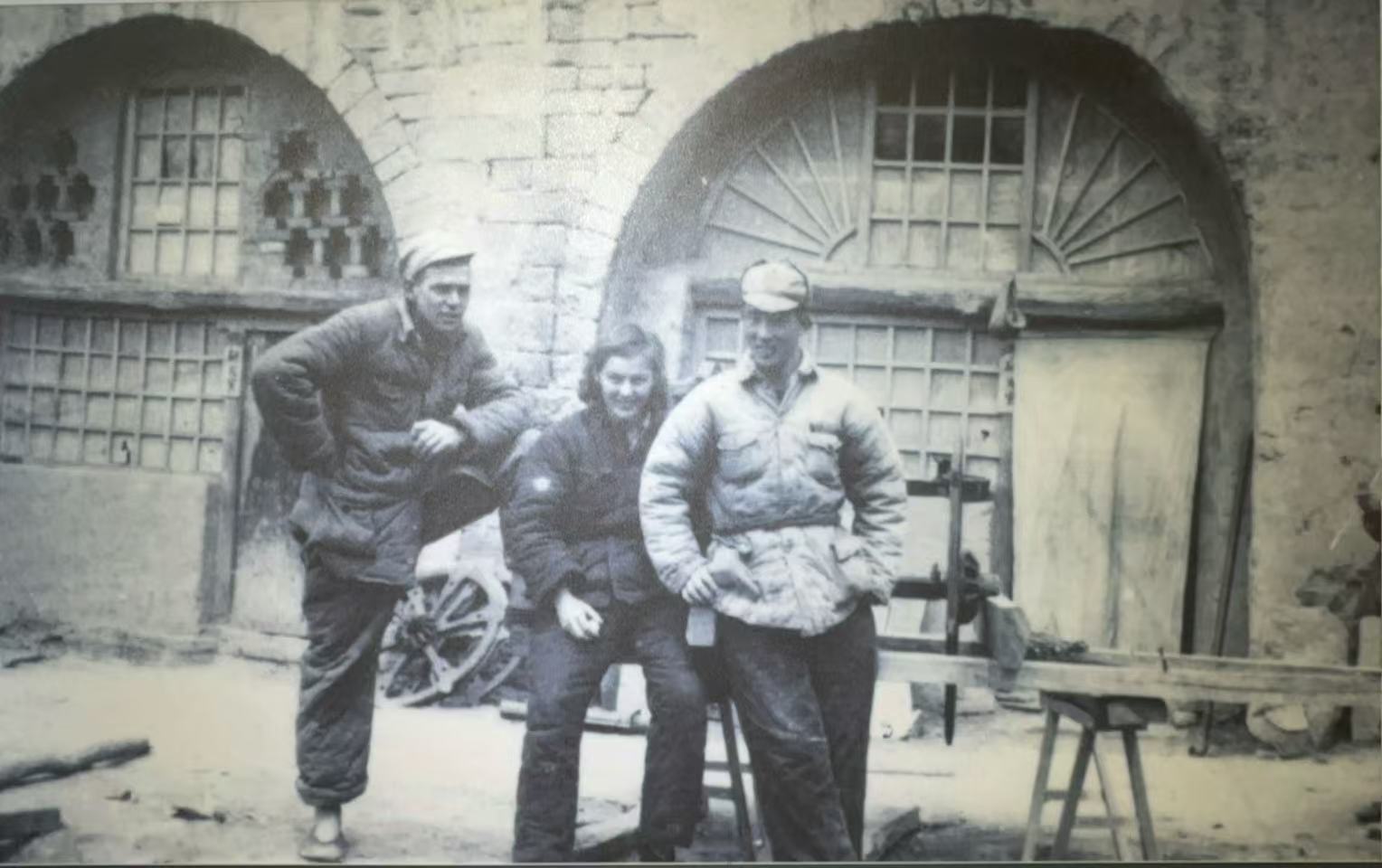 Erwin Engst (first from left) and Joan Hinton (center) photographed in front of a Yaodong (cave dwelling) in Yan'an, at the Yang Zao-Han Chun Sanbian Ranch Exhibition Hall, Chengchuan Town, Otog Front Banner, Ordos City, Inner Mongolia Autonomous Region, September 19, 2026. Wu Yan/CGTN
