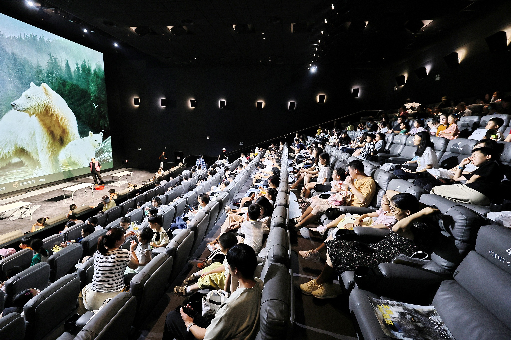 Children watch a science film with their parents at a cinema in Jiaxing, Zhejiang Province, September 13, 2026. /VCG