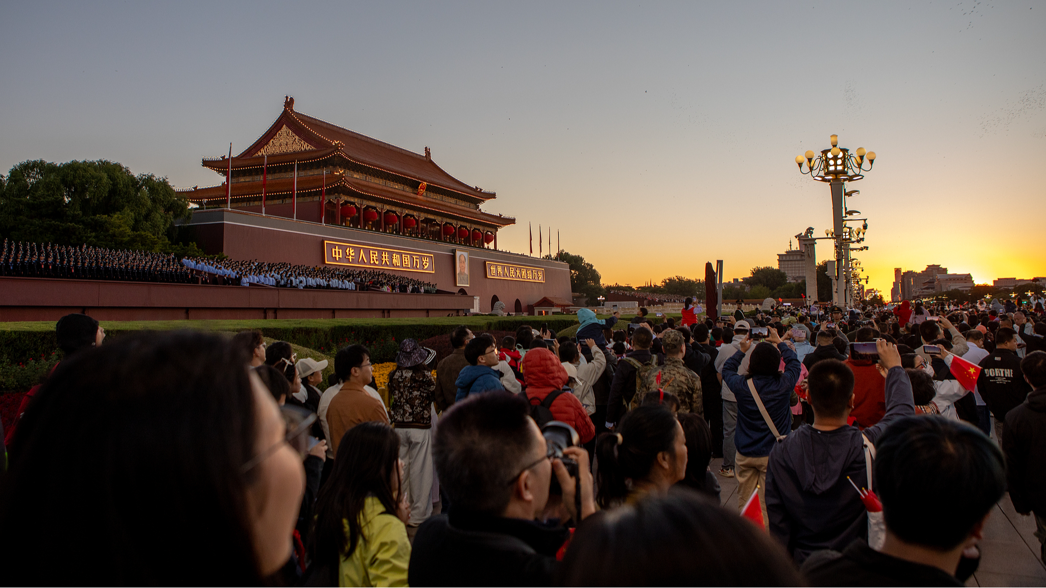 Crowds of people gather at Tiananmen Square for a flag-faising ceremony in Beijing, October 1, 2026. /VCG