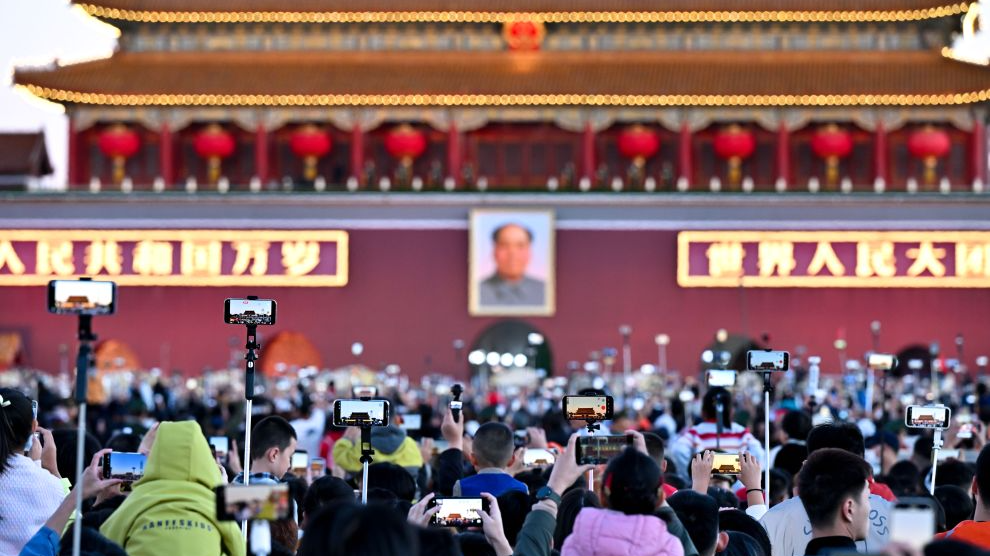 People attend a flag-raising ceremony marking the 77th anniversary of the founding of the People's Republic of China at Tiananmen Square in Beijing, capital of China, October 1, 2026. /Xinhua