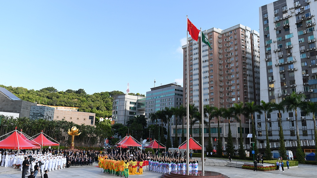A flag-raising ceremony to celebrate the 77th anniversary of the founding of the People's Republic of China is held at the Golden Lotus Square in Macao, south China, October 1, 2026. /VCG