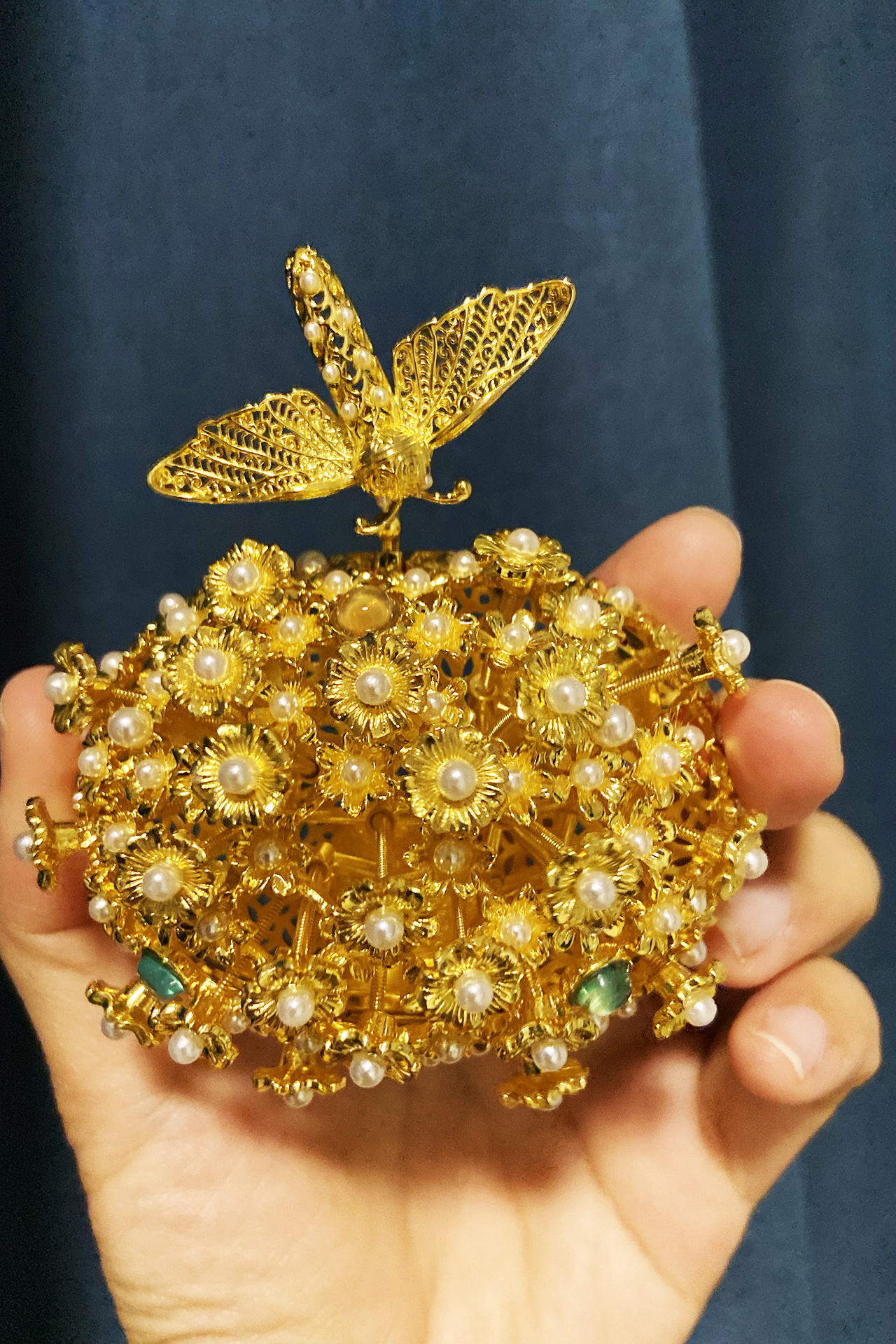 A cultural and creative product inspired by the moth hairpin. /CGTN