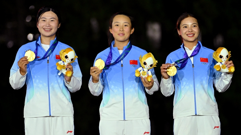 Chinese gold medalists Yan Liu, Zhang Weiwei and Yin Ruoning celebrate during the women's team medal ceremony at the 2026 Asian Games in Kasugai, Japan, October 3, 2026. /IC Photo