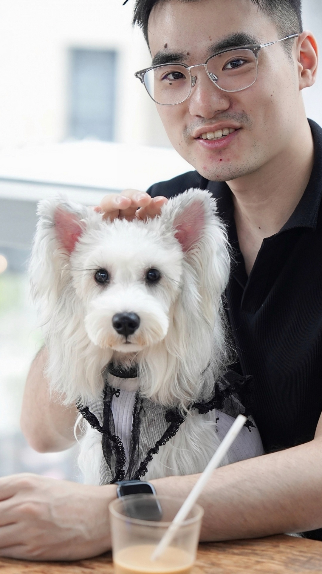 A pet owner and her dog are seen in Moganshan in Deqing County, east China's Zhejiang Province.  /Photo provided to CGTN 