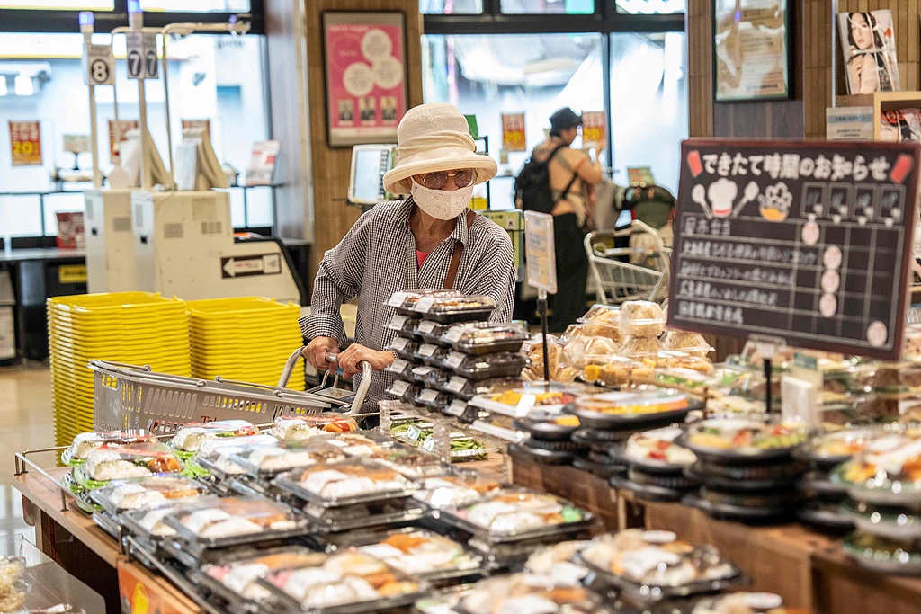 A customer shops for groceries at a supermarket in Tokyo, Japan, July 24, 2026. /VCG