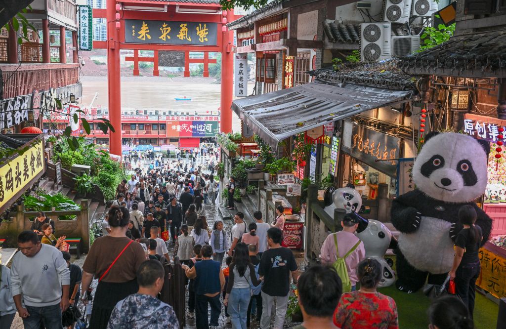 Visitors at the Ciqikou Ancient Town in Chongqing, southwest China, October 3, 2026. /Xinhua