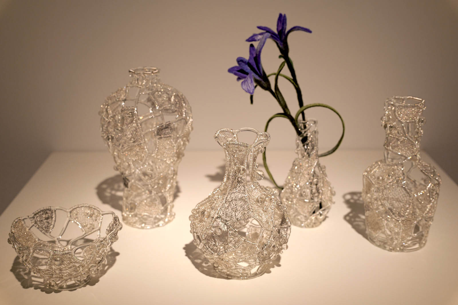 A set of glass artworks is seen on display at the ongoing 