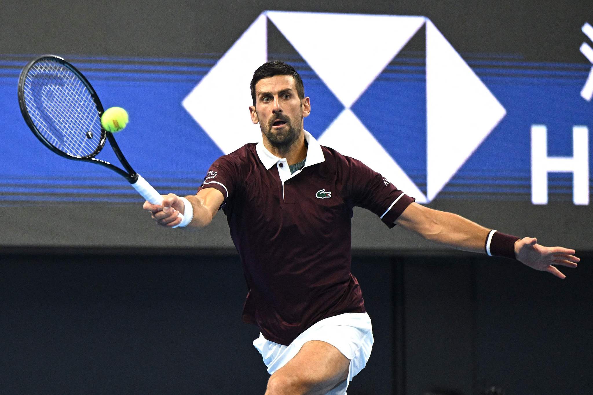 Serbia's Novak Djokovic hits a shot against Australia's Alex de Minaur in the men's singles final at the China Open in Beijing, China, October 6, 2026. /VCG