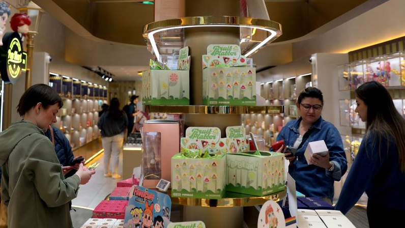 Customers shop for products at a POP MART store in London, May 21, 2025. /Xinhua