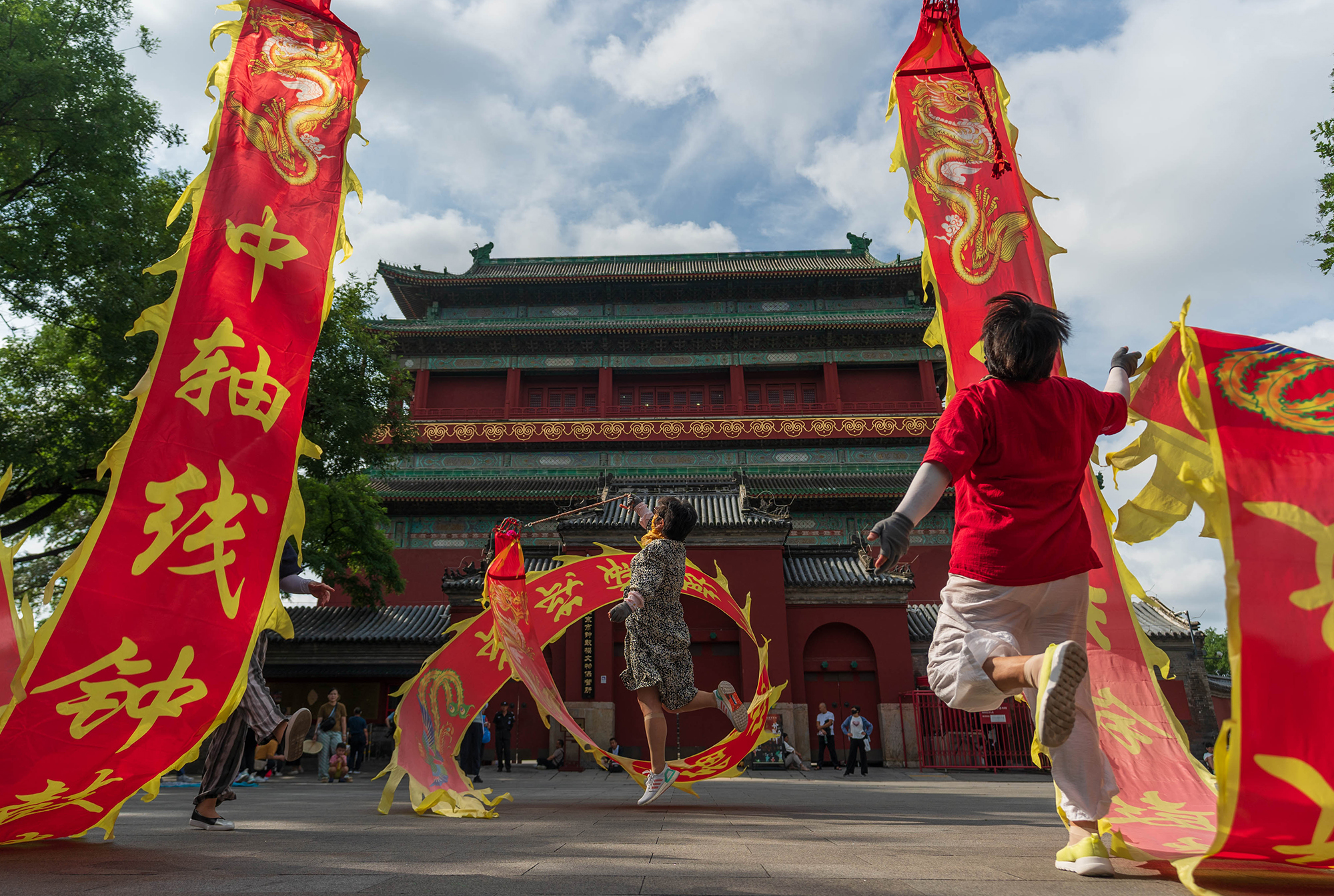 Elderly residents exercise along Beijing's Central Axis in Beijing, China, August 2024. /CGTN