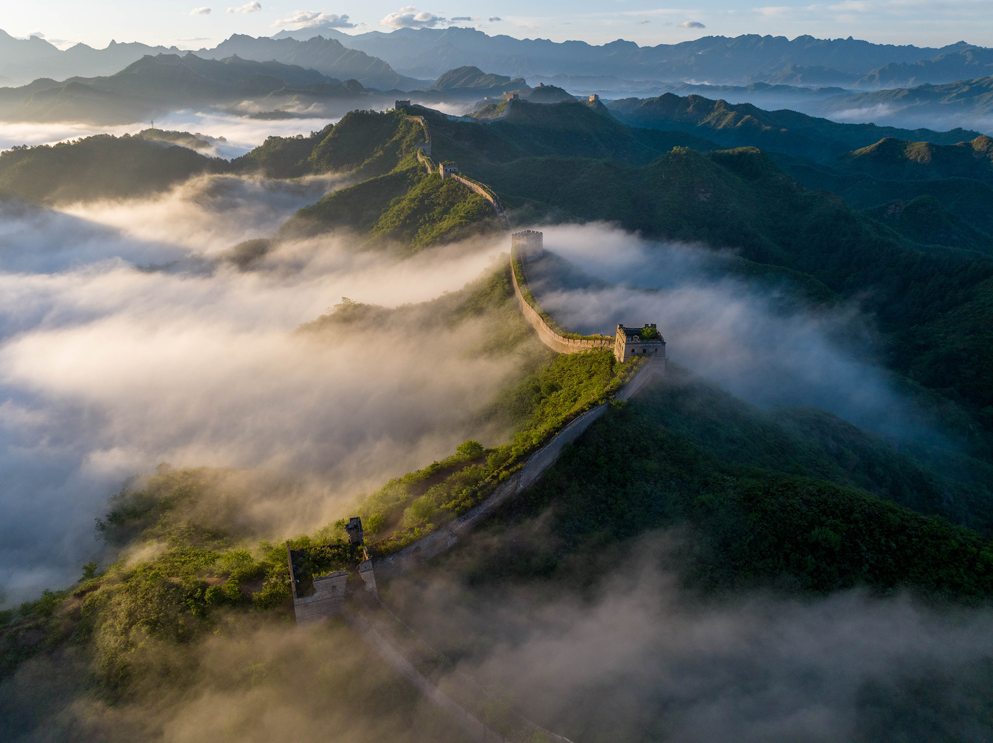 Clouds drift over the Great Wall after summer rain in Beijing, China, May 2024. /CGTN