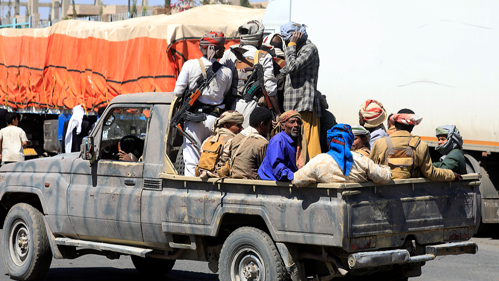 Houthi fighters ride in a pickup truck on a street in Sanaa, Yemen, October 7,  2026. /VCG
