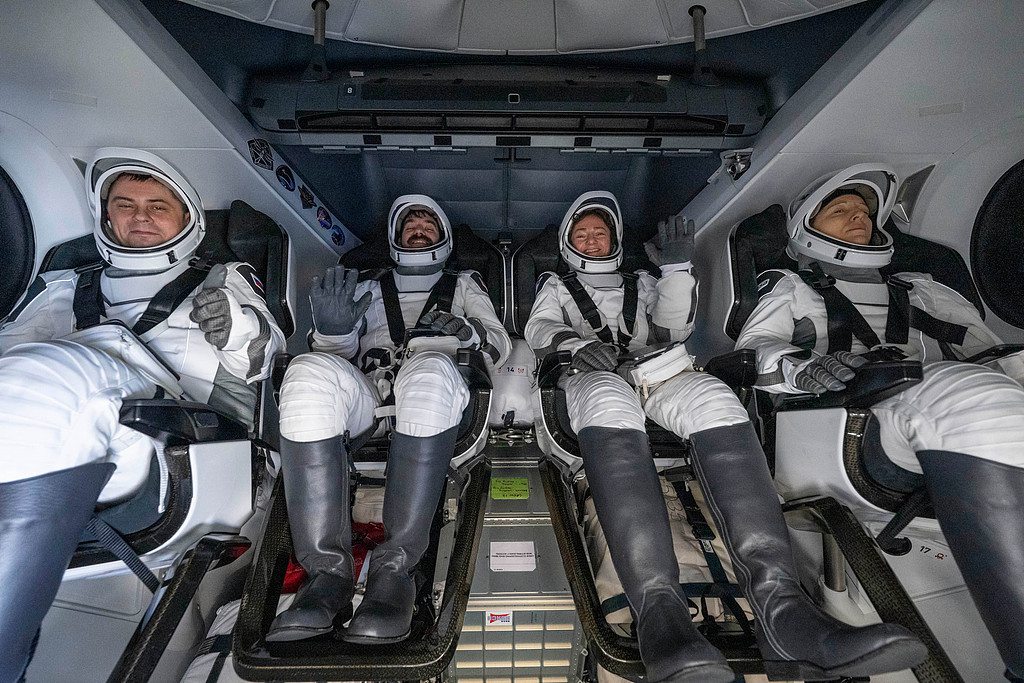 From left: Roscosmos cosmonaut Andrey Fedyaev, NASA astronauts Jack Hathaway and Jessica Meir, and European Space Agency astronaut Sophie Adenot sit inside the SpaceX Dragon Freedom spacecraft onboard the SpaceX recovery ship Shannon after splashdown in the Pacific Ocean off the coast of California, October 8, 2026. /VCG