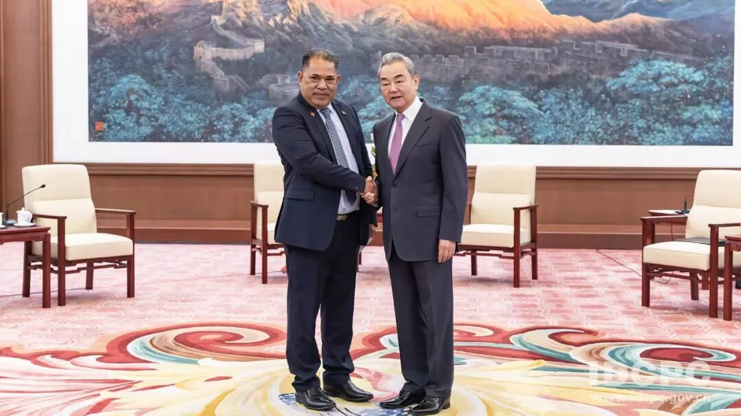 Wang Yi, a member of the Political Bureau of the Communist Party of China (CPC) Central Committee and director of the Office of the Foreign Affairs Commission of the CPC Central Committee, shakes hands with Tongan Deputy Prime Minister Viliami Uasike Latu in Beijing, China, October 9, 2026. /IDCPC
