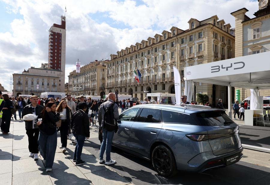 Visitors view a model displayed by Chinese high-tech car manufacturer BYD at the Turin Auto Show in Turin, Italy. BYD's Yangwang U9 received the China Performance Car of the Year award, September 27, 2025. /Xinhua