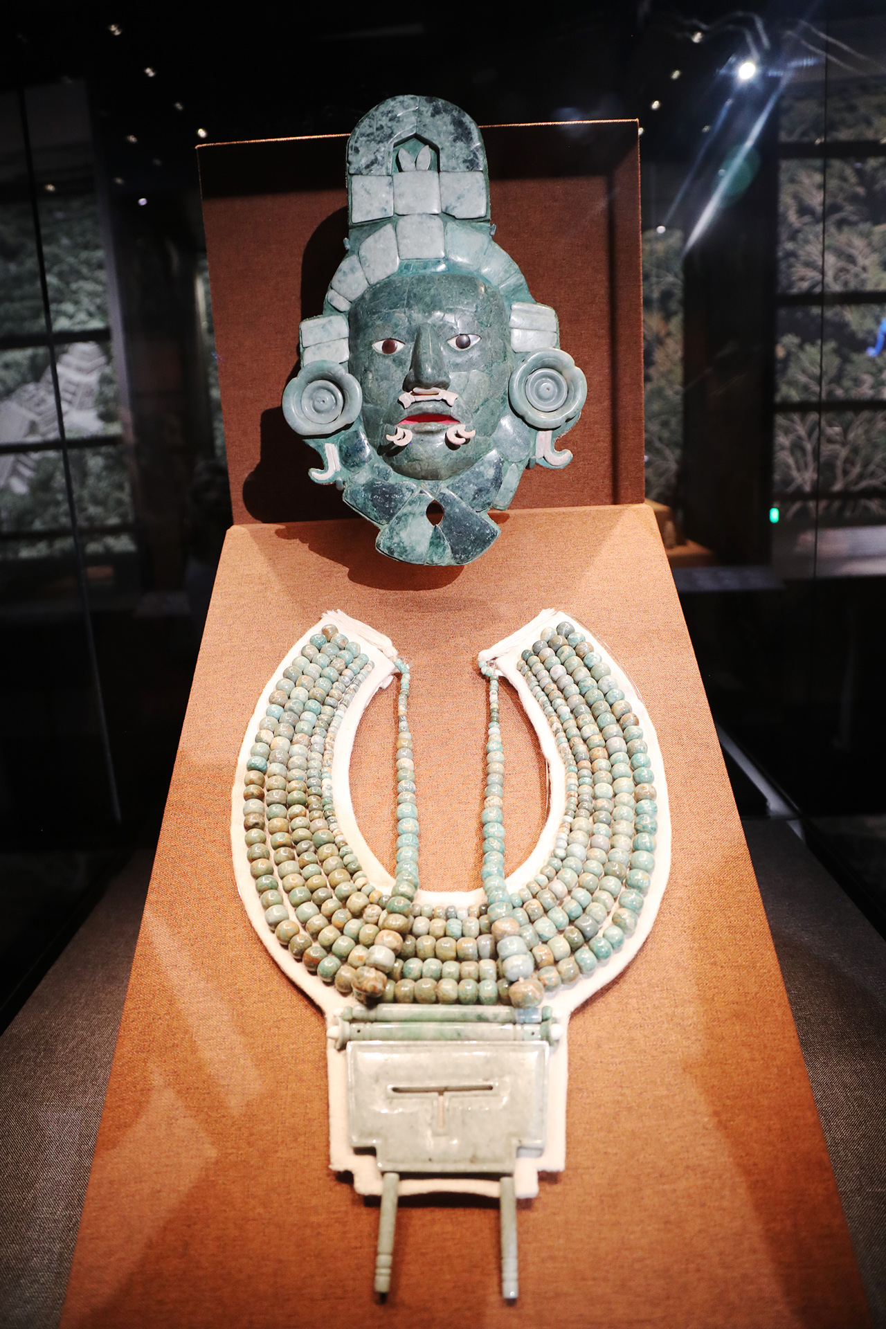Replicas of a jade mask and jewelry are seen on display at the 
