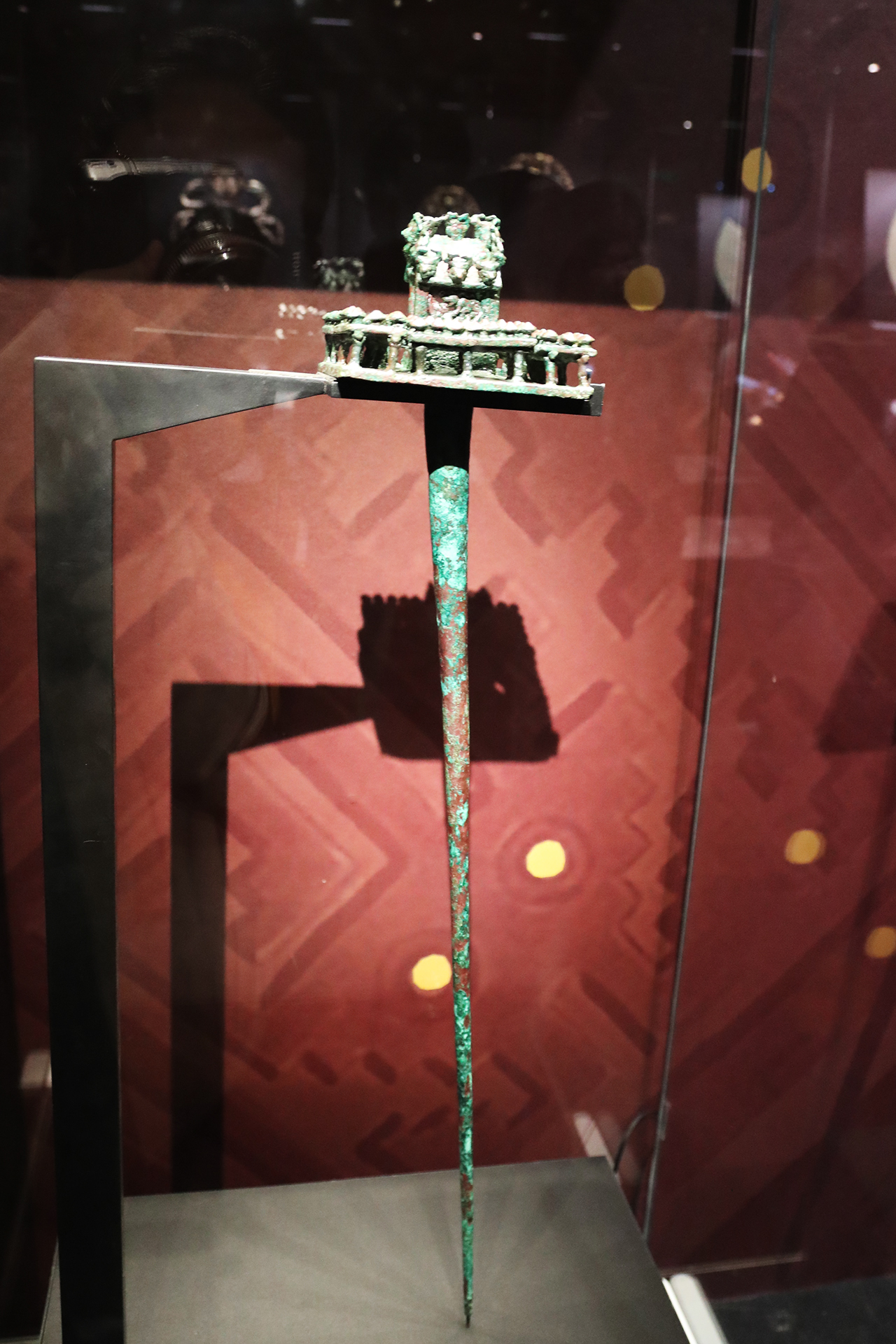 A copper scepter is seen on display at the 