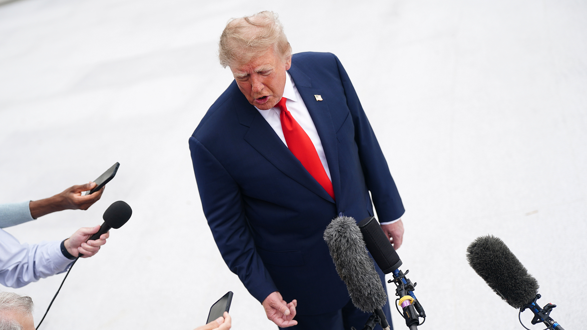 US President Donald Trump speaks to the media before boarding Marine One on the South Lawn of the White House in Washington, DC, October 10, 2026. /VCG