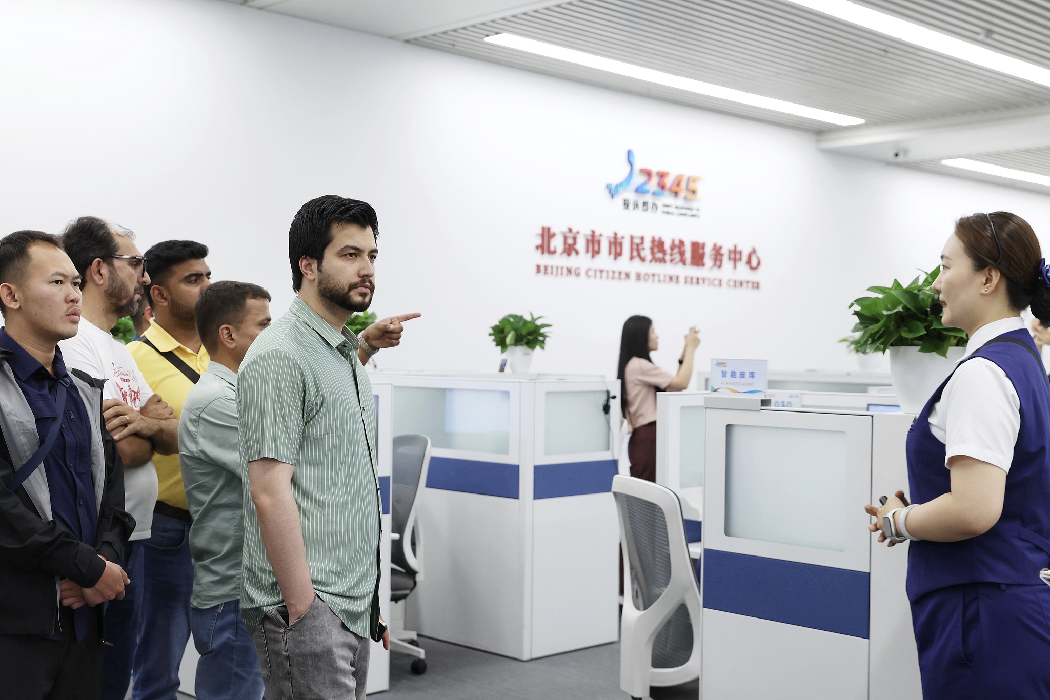 Media professionals from different Asian countries visit the Beijing 12345 Citizen Service Hotline Center in Beijing, June 26, 2026. /CFP