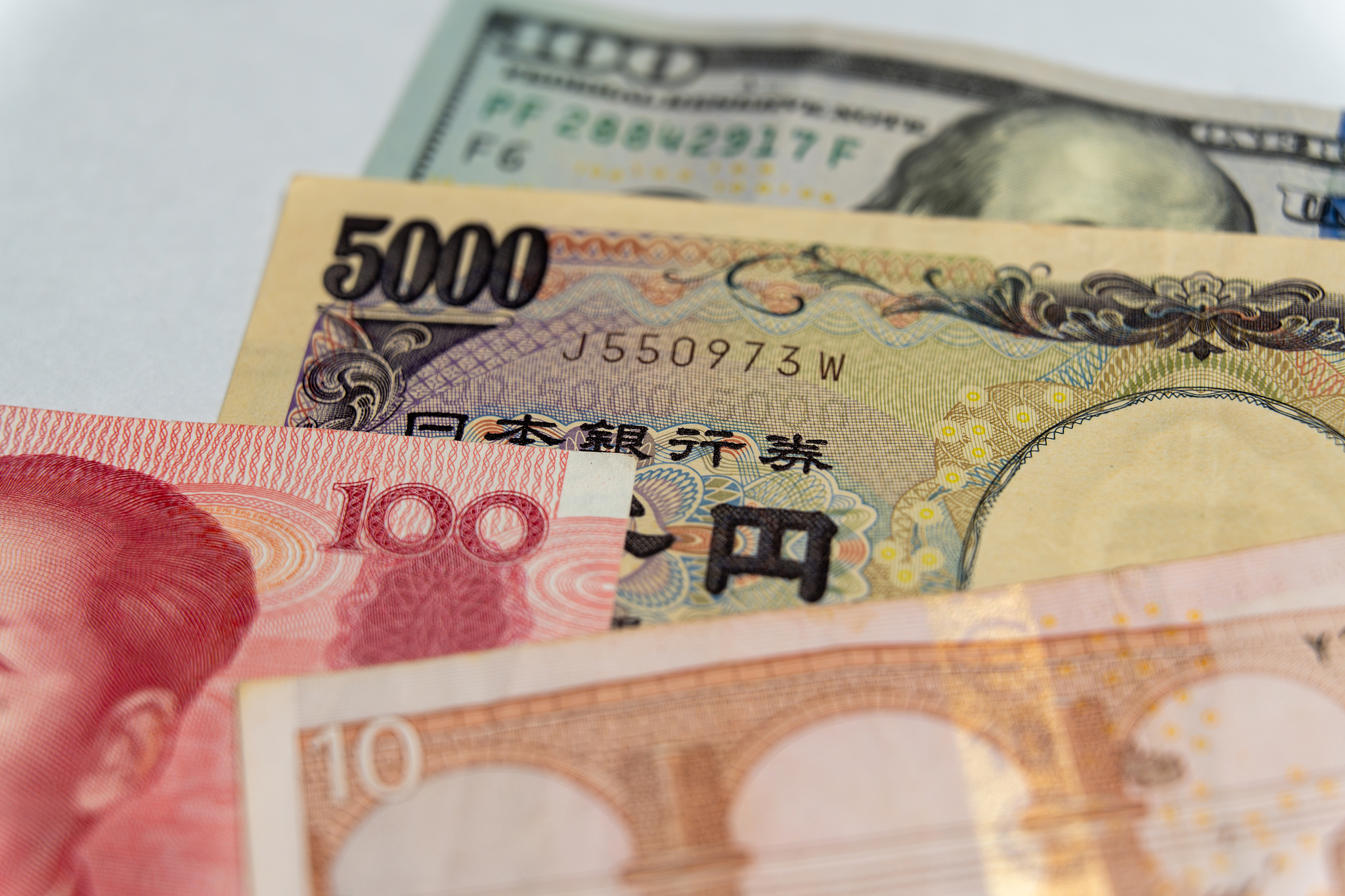 The US dollar, Japanese yen, Chinese renminbi, and euro banknotes. /VCG