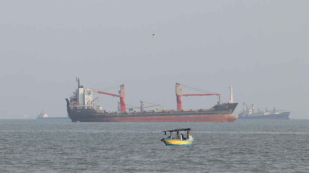 Commercial vessels anchored in the Strait of Hormuz off Bandar Abbas, Iran, October 13, 2026. /VCG