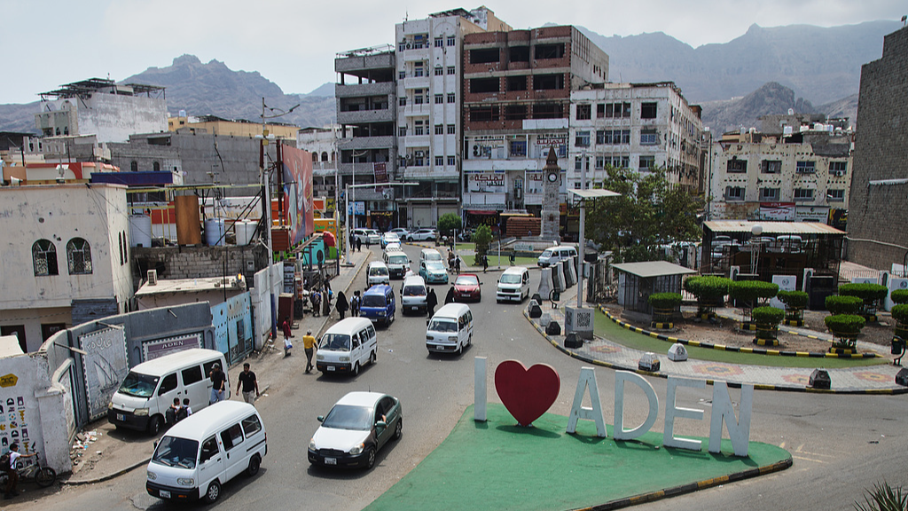 Traffic moves through a roundabout featuring a landmark sign promoting the city of Aden in Aden, Yemen, October 11, 2026. /VCG