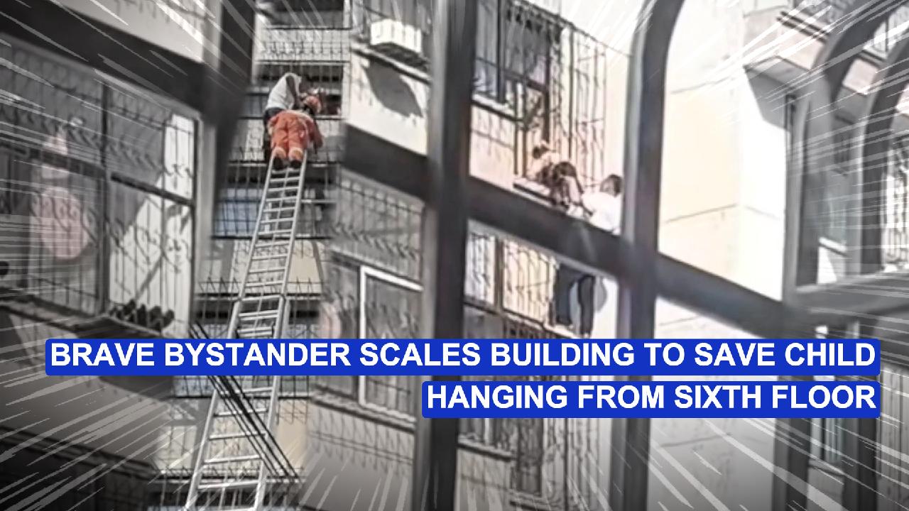 Brave bystander scales building to save child hanging from sixth floor