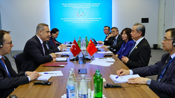 Chinese Foreign Minister Wang Yi meets with Turkish Foreign Minister Hakan Fidan on the sidelines of the 7th Summit of the Conference on Interaction and Confidence Building Measures in Asia in Baku, Azerbaijan, October 15, 2026. /Chinese Foreign Ministry