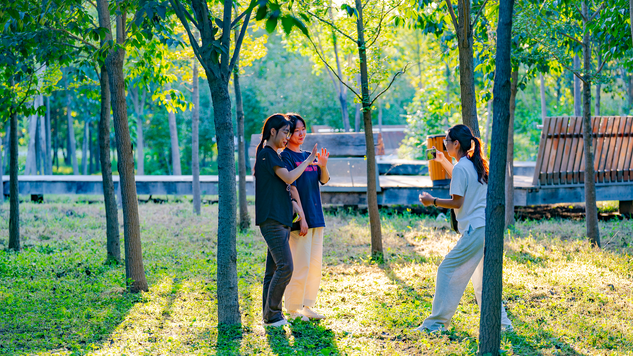 Tourists take photos amid the lush 