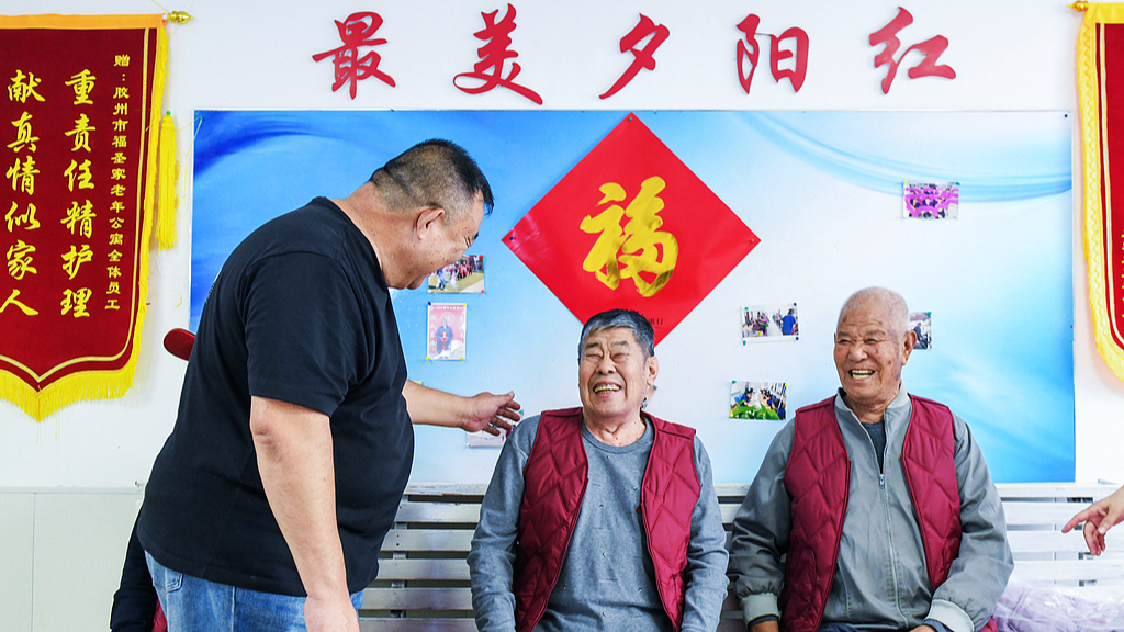 A man chats with elderly residents at a senior care home in Jiaozhou, Shandong Province, China, October 17, 2026. /VCG