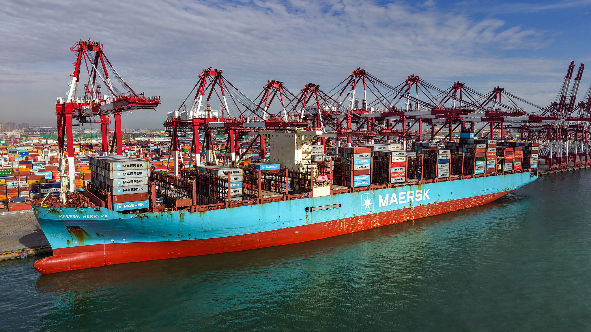 Container ships load and unload cargo at Qingdao Qianwan Container Terminal, Shandong Province, China, on October 19, 2026. /VCG