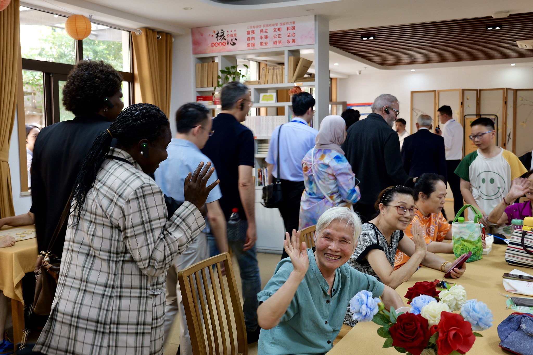 Chinese and international guests meet with elderly residents from the community during an event in Hangzhou, Zhejiang Province, east China, June 7, 2026. /CFP