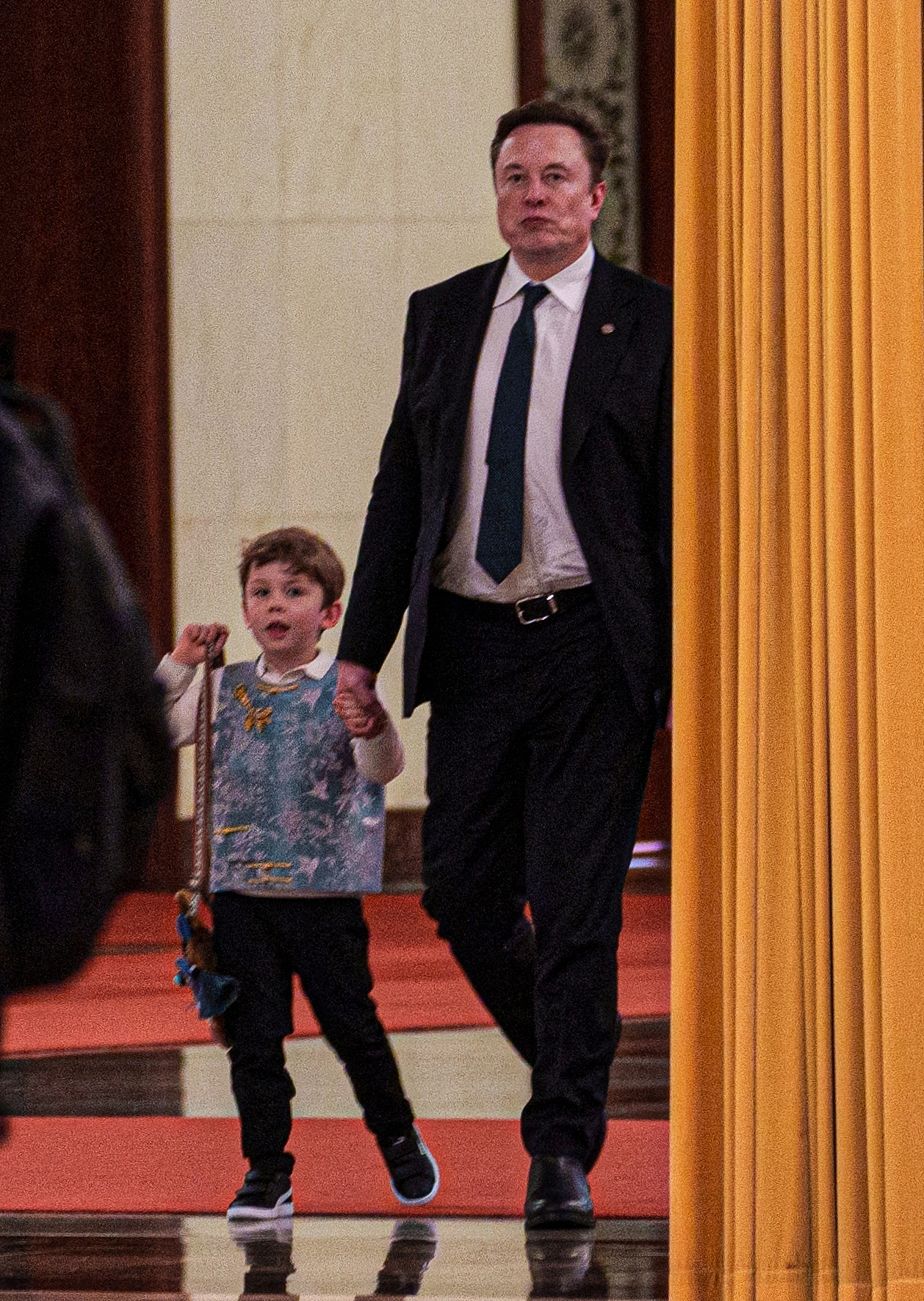 Tesla and SpaceX founder Elon Musk with his son at the Great Hall of the People in Beijing, China, on May 14, 2026. /VCG