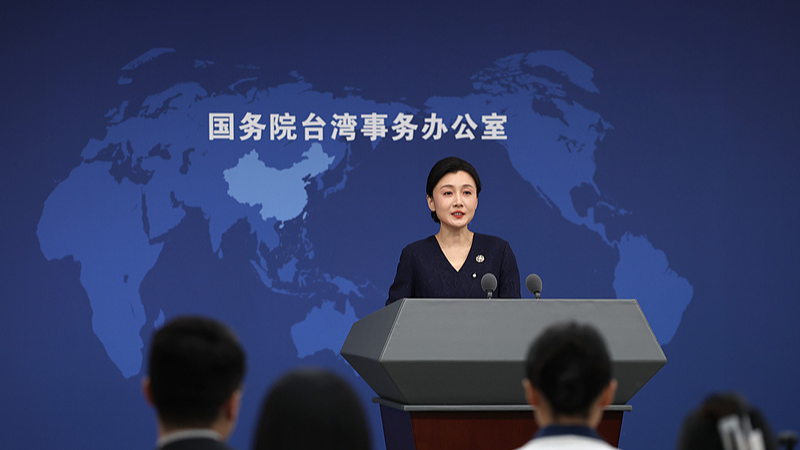Zhang Han, spokesperson for the State Council Taiwan Affairs Office, speaks at a regular news briefing in Beijing, China, October 21, 2026. /VCG