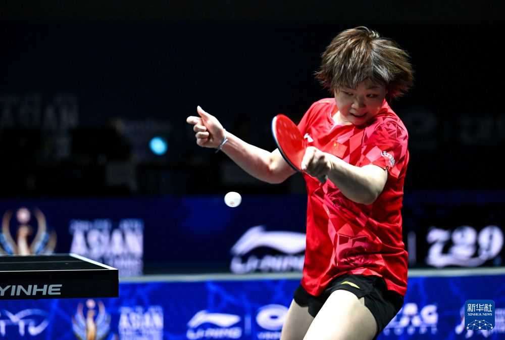 China's Kuai Man hits a shot against Thailand's Suthasini Sawettabut during their match in the women's team quarterfinals at the Asian Table Tennis Championships in Tashkent, Uzbekistan, October 21, 2026. /Xinhua