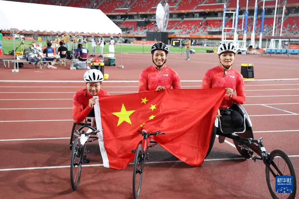 From left: Bronze medalist Zhang Yuan, gold medalist Zhou Zhaoqian and silver medalist Tian Yajuan of China celebrate after sweeping the women's 400 meter T54 podium at the 2026 Aichi-Nagoya Asian Para Games in Nagoya, Japan, October 21, 2026. /Xinhua