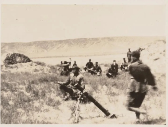 Chinese Red Army soldiers fire a mortar on the front line in northwest China's Ningxia Hui Autonomous Region. /L. Tom Perry Special Collections at Brigham Young University's Harold B. Lee Library