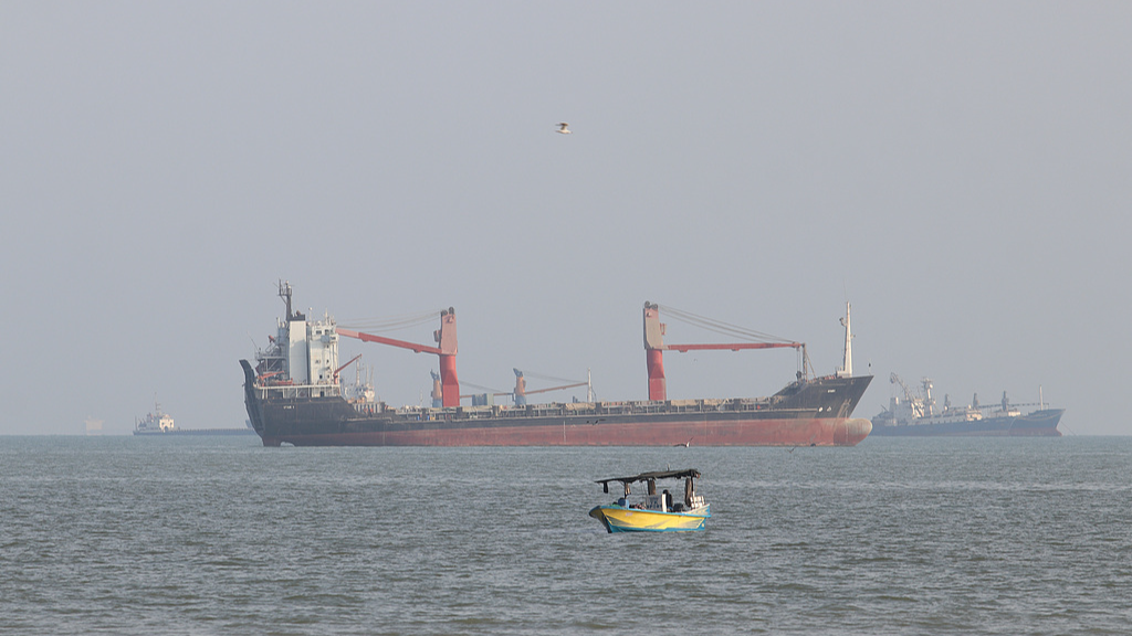 Commercial vessels appear anchored in the Strait of Hormuz off Bandar Abbas, Iran, October 19, 2026. /VCG