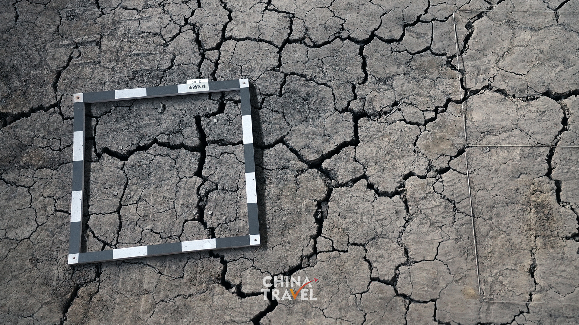 Marked test areas on the exposed earth highlight the careful work of studying and protecting the site itself. /CGTN