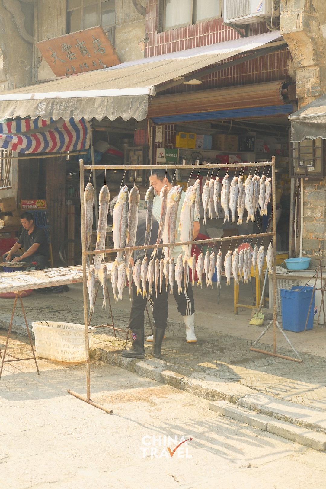 Fish drying in the open air offer a glimpse of the food traditions woven into everyday life in Datong Ancient Town. /CGTN