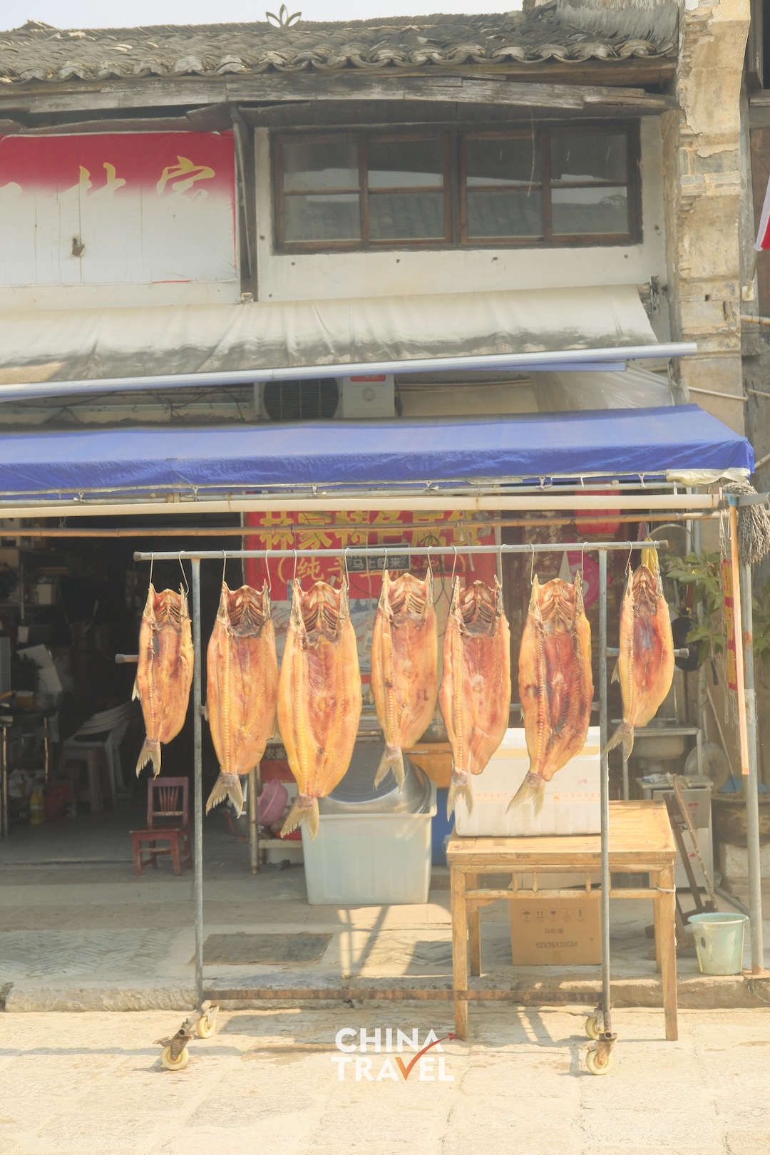 Fish drying in the open air offer a glimpse of the food traditions woven into everyday life in Datong Ancient Town. /CGTN