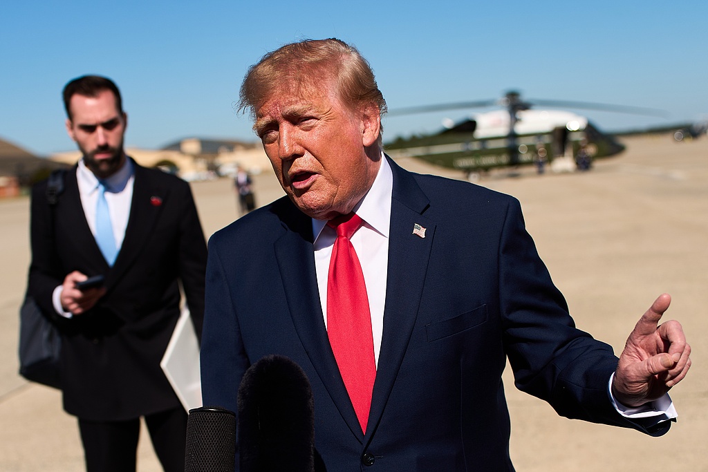 US President Donald Trump speaks to reporters before boarding Air Force One at Joint Base Andrews, US, October 25, 2026. /VCG