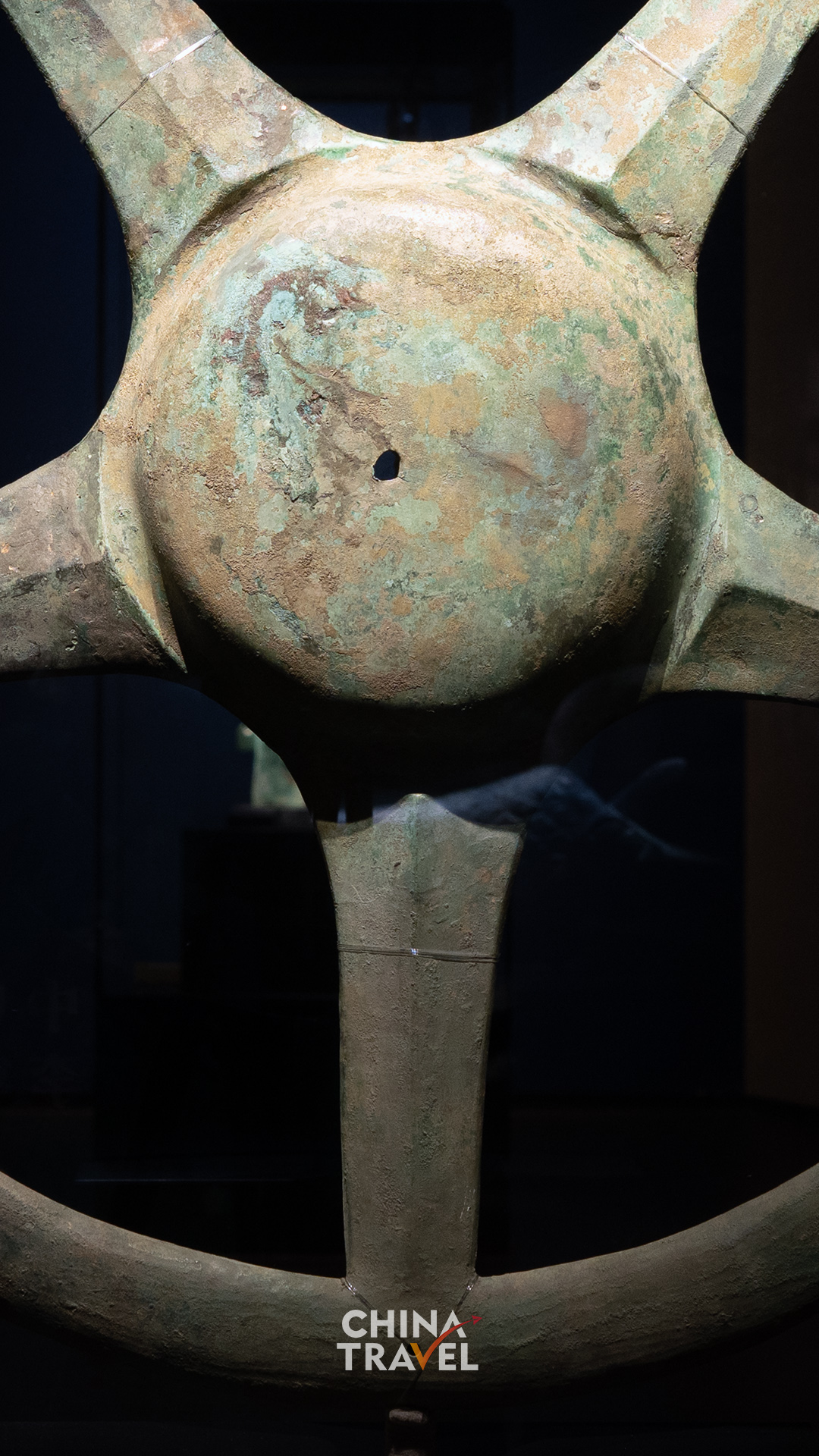 Close and side views bring the raised center, surface texture and depth of the bronze into focus. /CGTN